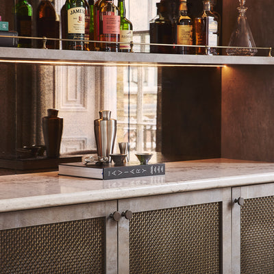 Features our 10mm Square Interwoven Grille with 3mm Reeded Wire in our antique brass lacquered (ABL) grille finish | Project by Cor Domi | Photography by 82mm Photography (Malcom Menzies).