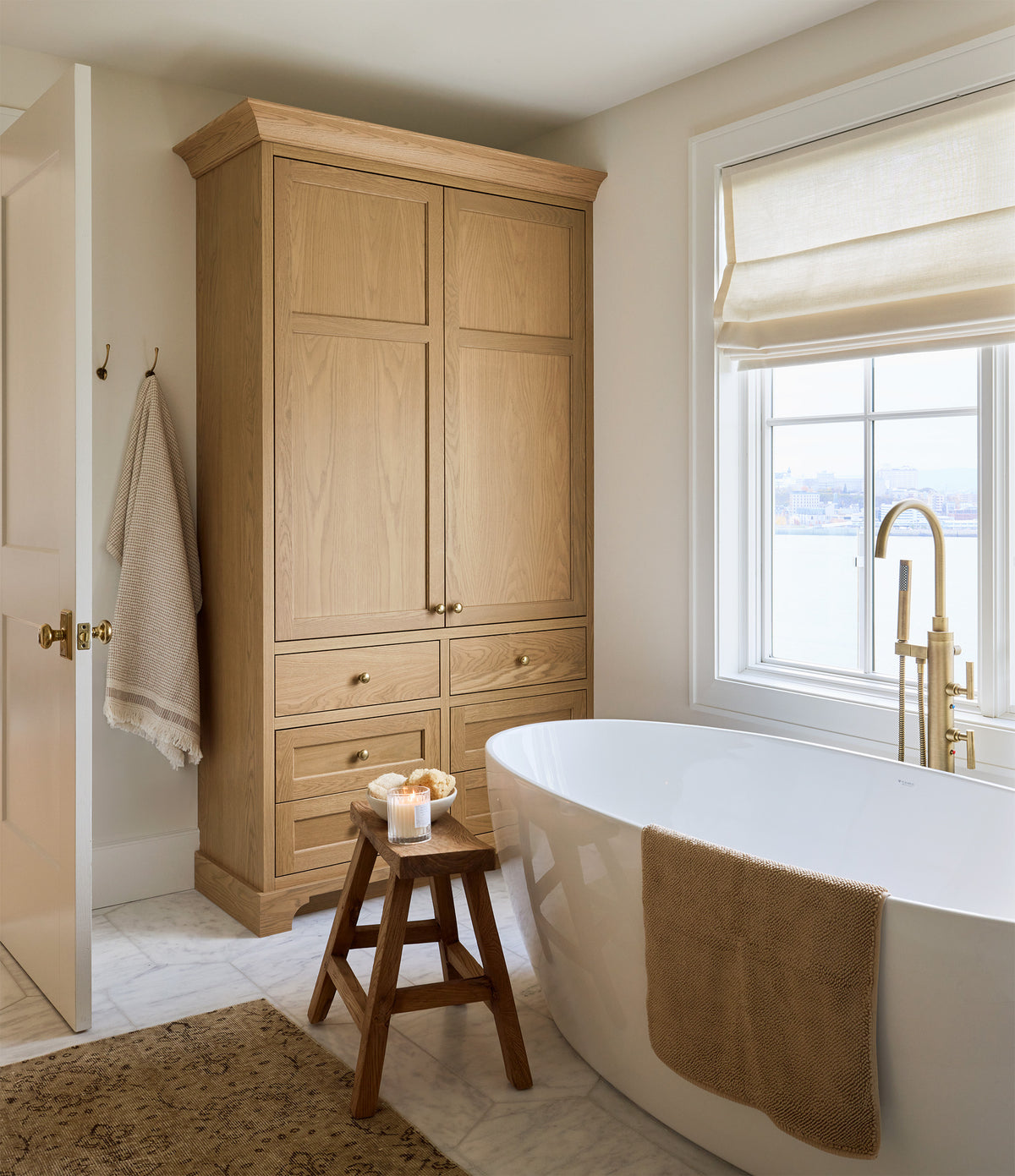 Bathroom design with brass bathroom accessories and hardware by AKB Design