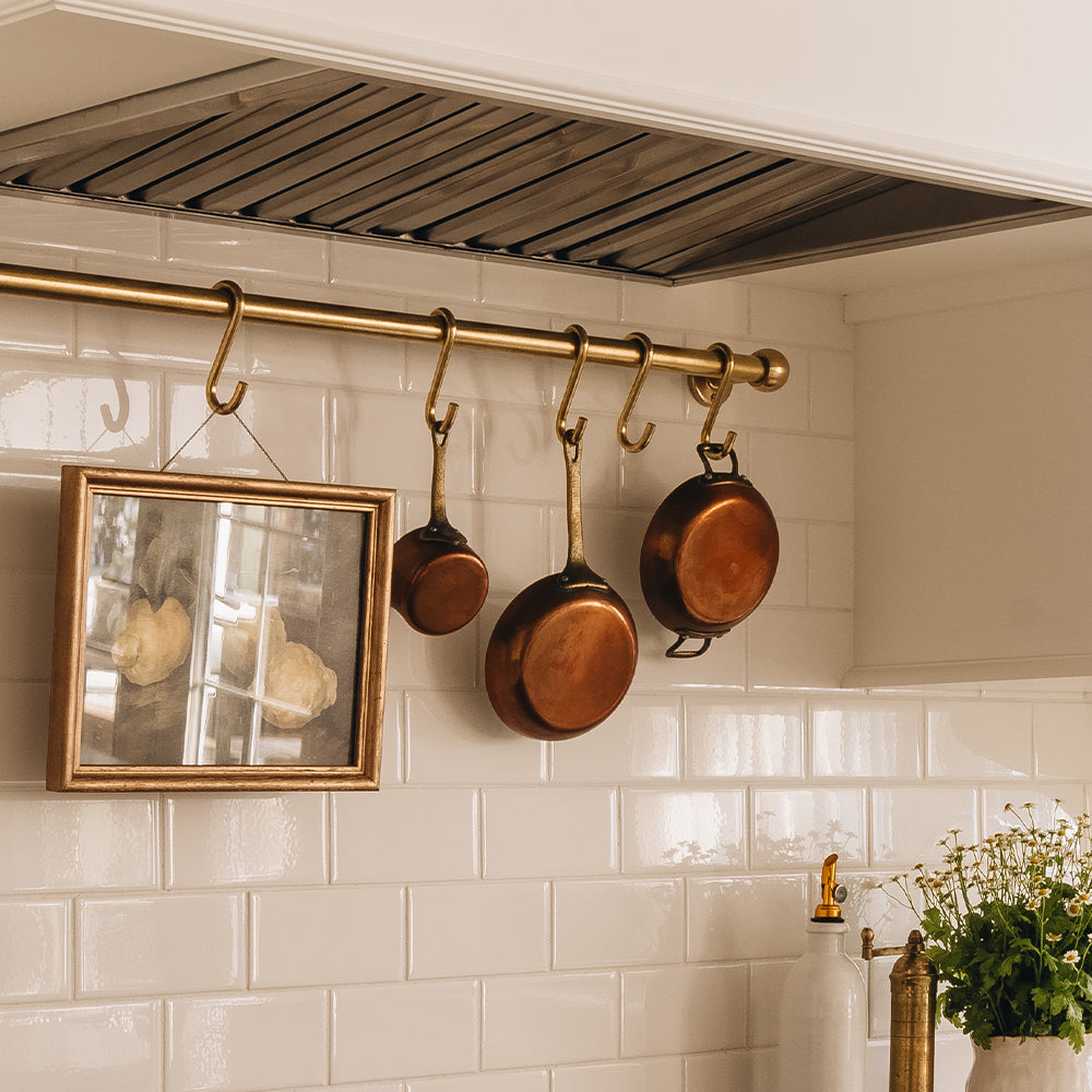 Design by AKB Design | Photography by Charles-Olivier Richard | Cotswold Brass Pot Rail & S Hooks shown in our aged brass (BEL) finish.