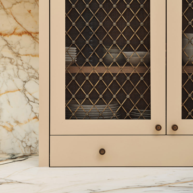 Features our Large Regency Diamond Grille with Alternating Plain Rosettes and Coarse Mesh Backing in our antique brass lacquered (ABL) grille finish | Project by Laura Butler-Madden | Photography by Patrick Butler-Madden.