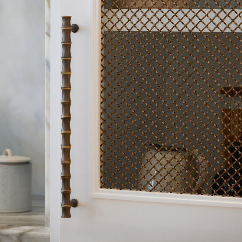 Features our 10mm Diamond Interwoven Grille with 3mm Reeded Wire in our antique brass lacquered (ABL) grille finish | Project by Sophie Paterson | Photography by Ray Main.