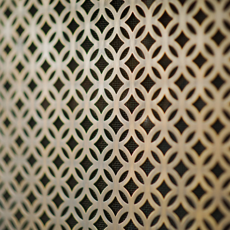 Features our Perforated Interlocking Circle Grille with Fine Mesh Backing in our antique brass unlacquered (ABL) grille finish | Project by Brownlow Furniture.