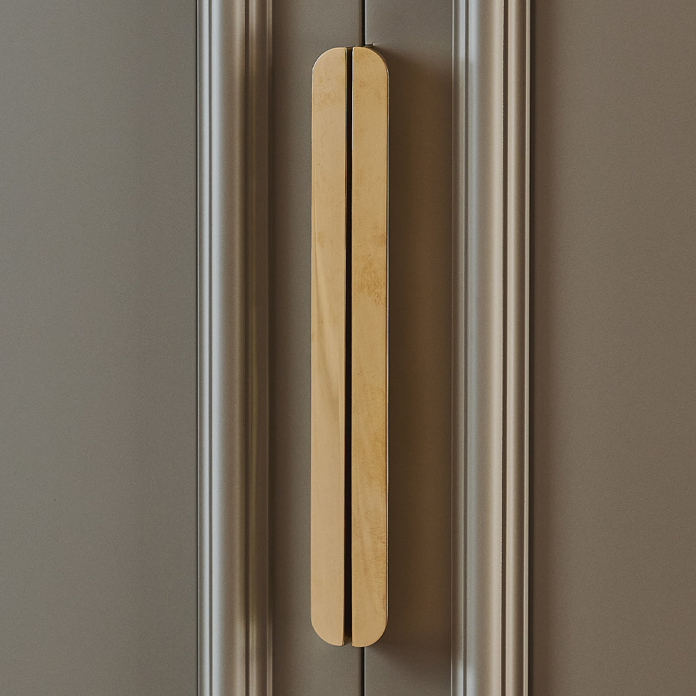 Design by Naked Kitchens | Edgbaston Curved Pull Handles shown in our polished brass unlacquered (PBUL) finish.