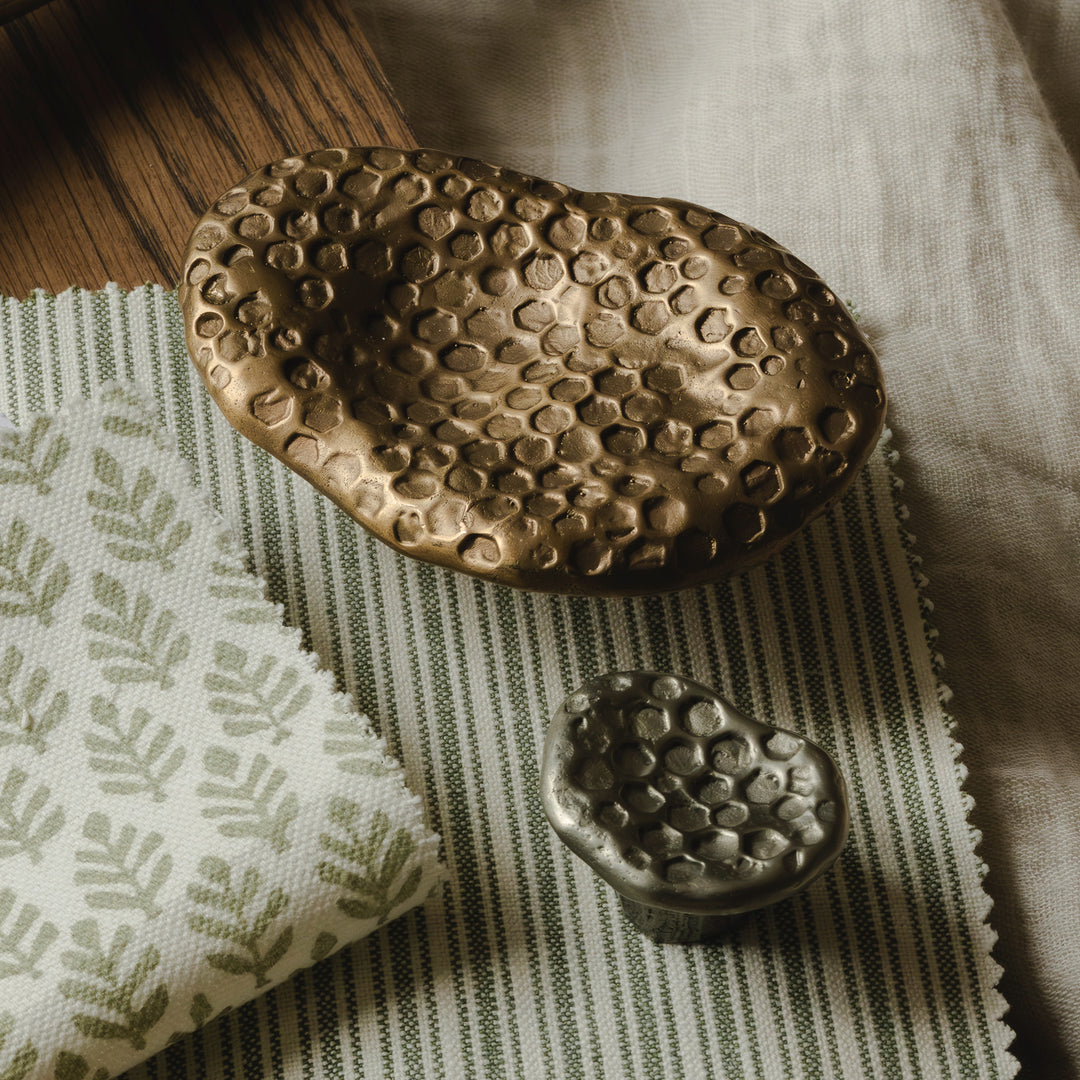 Photography by Joey Kendal Brown | Highbury Honey Oval Pull Handle and Highbury Honey Cabinet Knob shown in burnished bronze (BR) and burnished white bronze (WB).