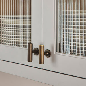 Design by Cor Domi | Kingsheath T-bar handle shown in our satin antique satin lacquered (SAS) finish.